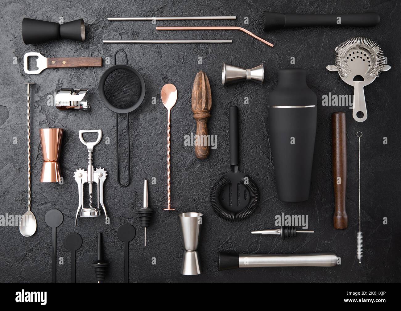 Various cocktail bar utensils set. Strainer,shaker,jigger,straw,juicer