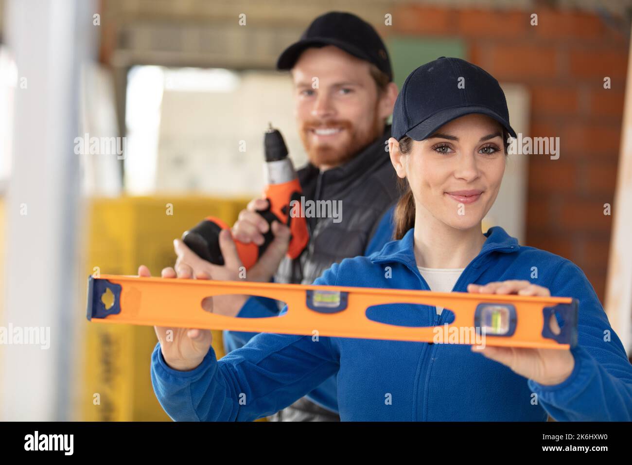 woman construction engineer with spirit level Stock Photo - Alamy