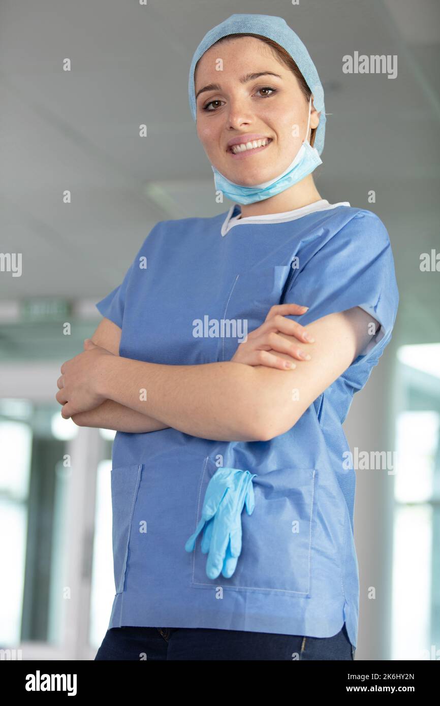 portrait of female nurse wearing lowered mask Stock Photo - Alamy