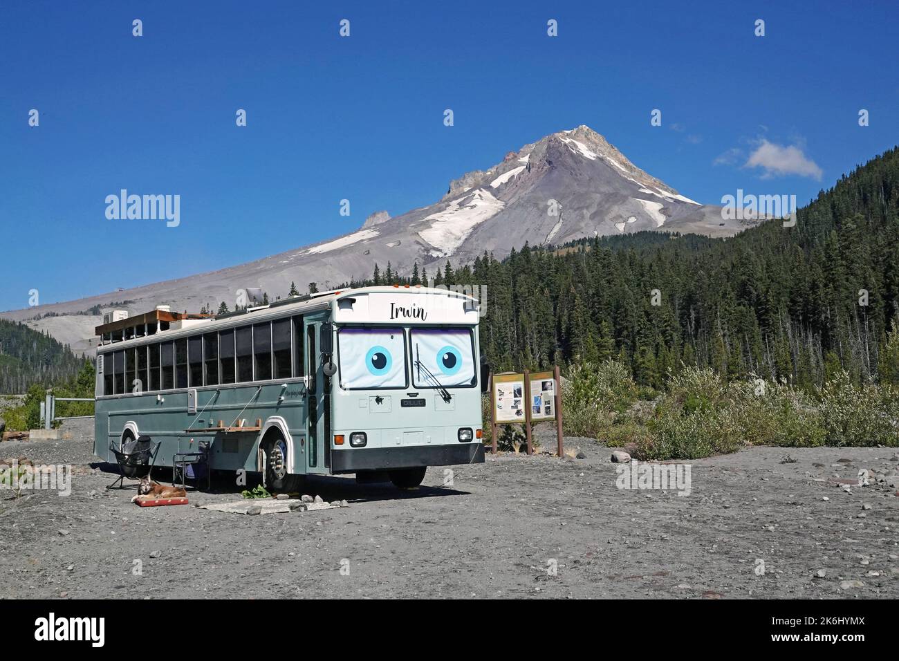 A large bus, turned into a camper, parked at White River Sno Park below Mount Hood, in the Oregon Cascades. Stock Photo