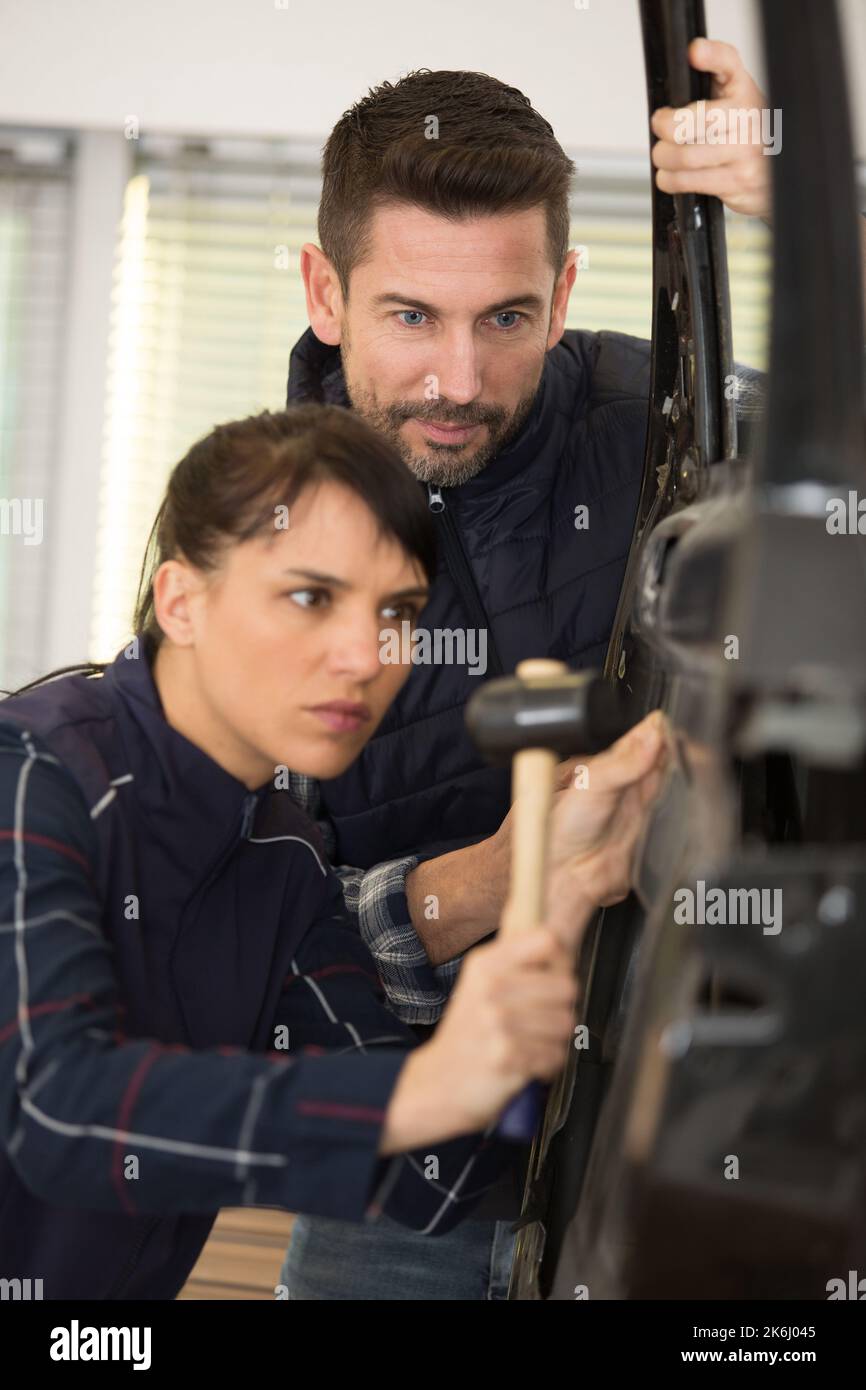 apprentice female panel beater in training Stock Photo Alamy
