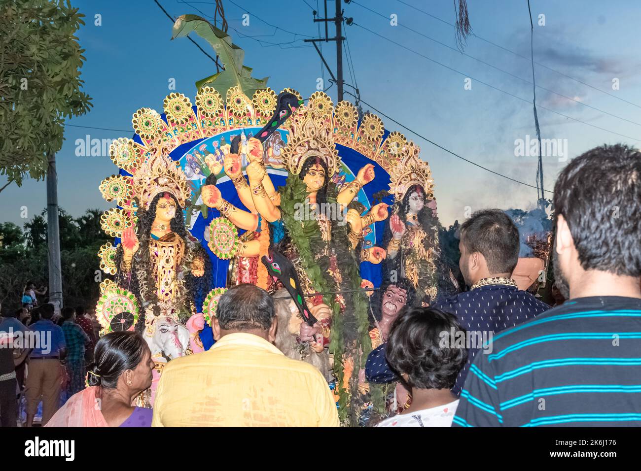 Devotees immerse Durga Idol on River Ganges during the last day of Durga Puja festival . Stock Photo