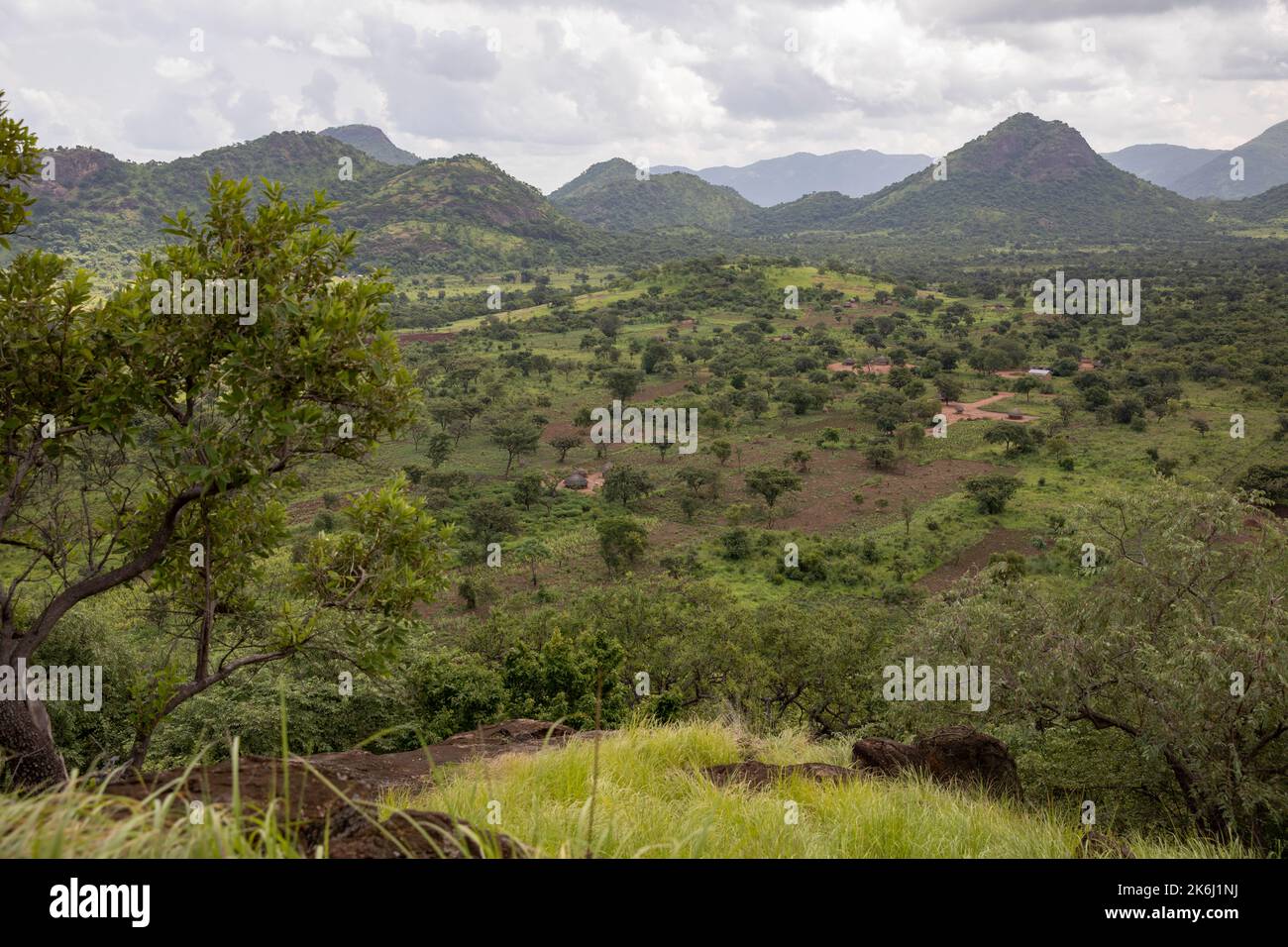 Green valley beneath the hills of Abim District, Uganda, East Africa Stock Photo