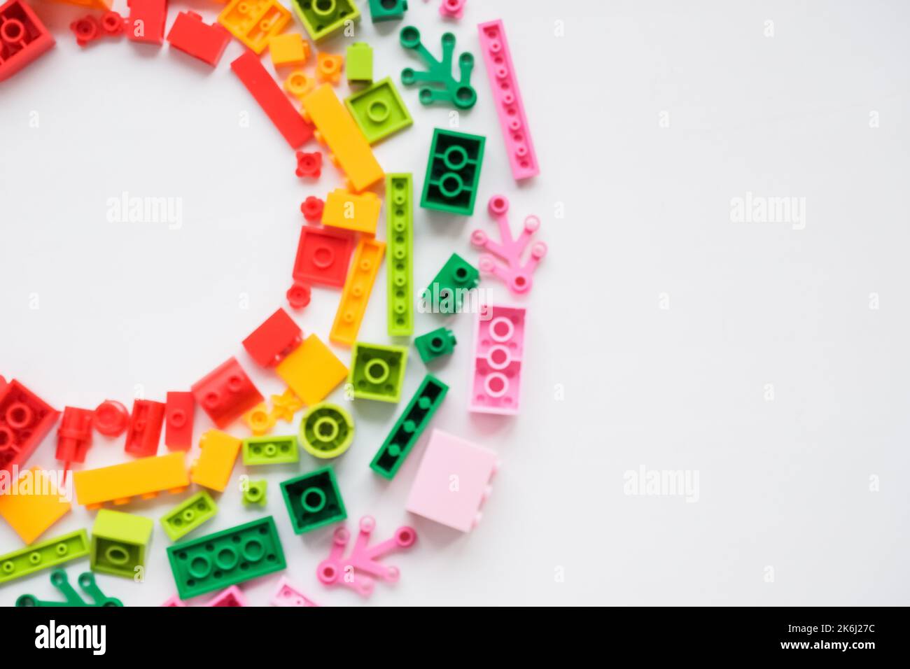 Flat lay colorful plastic building blocks on white background. Baby ...