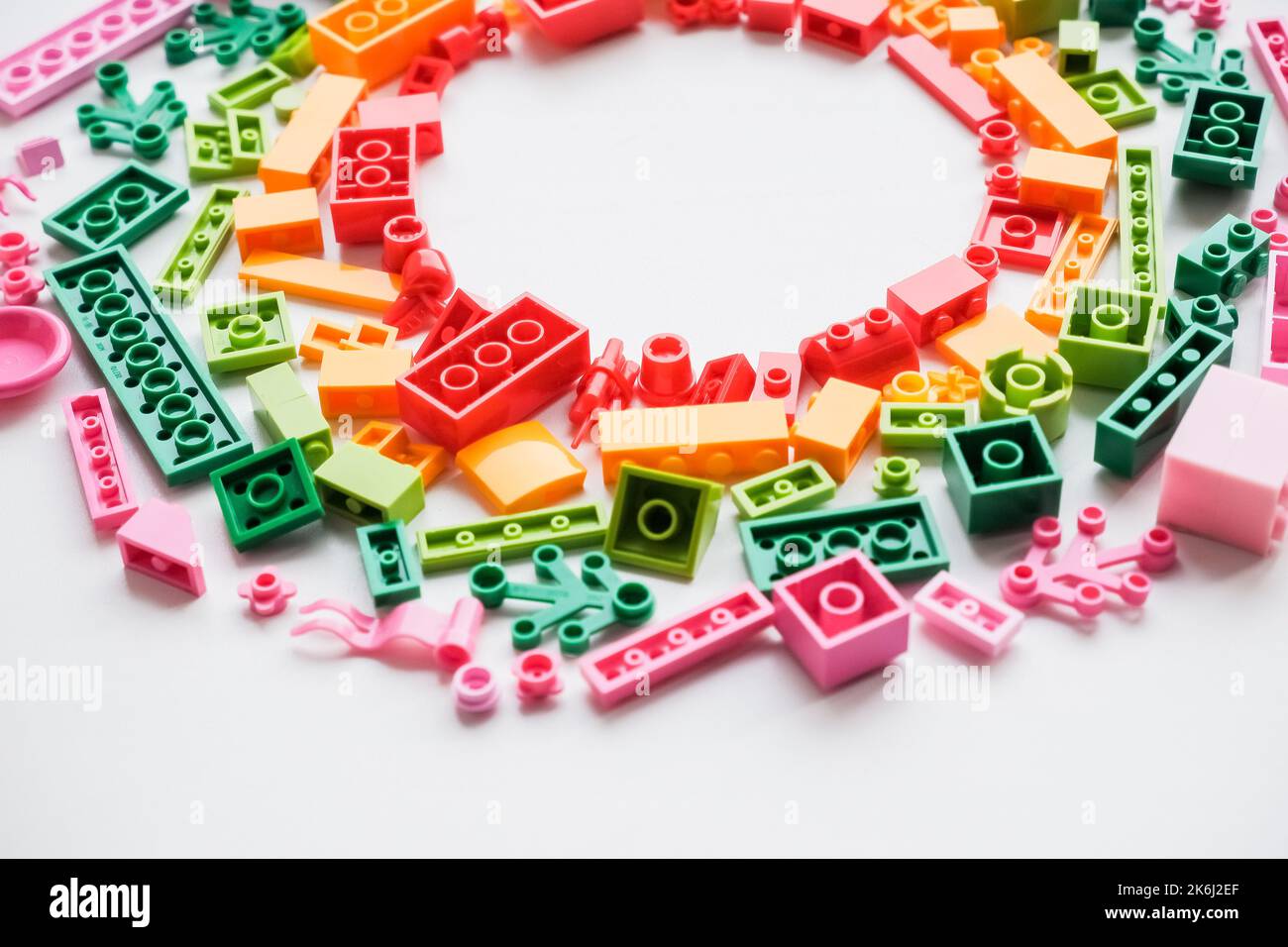 Flat lay colorful plastic building blocks on white background. Baby ...