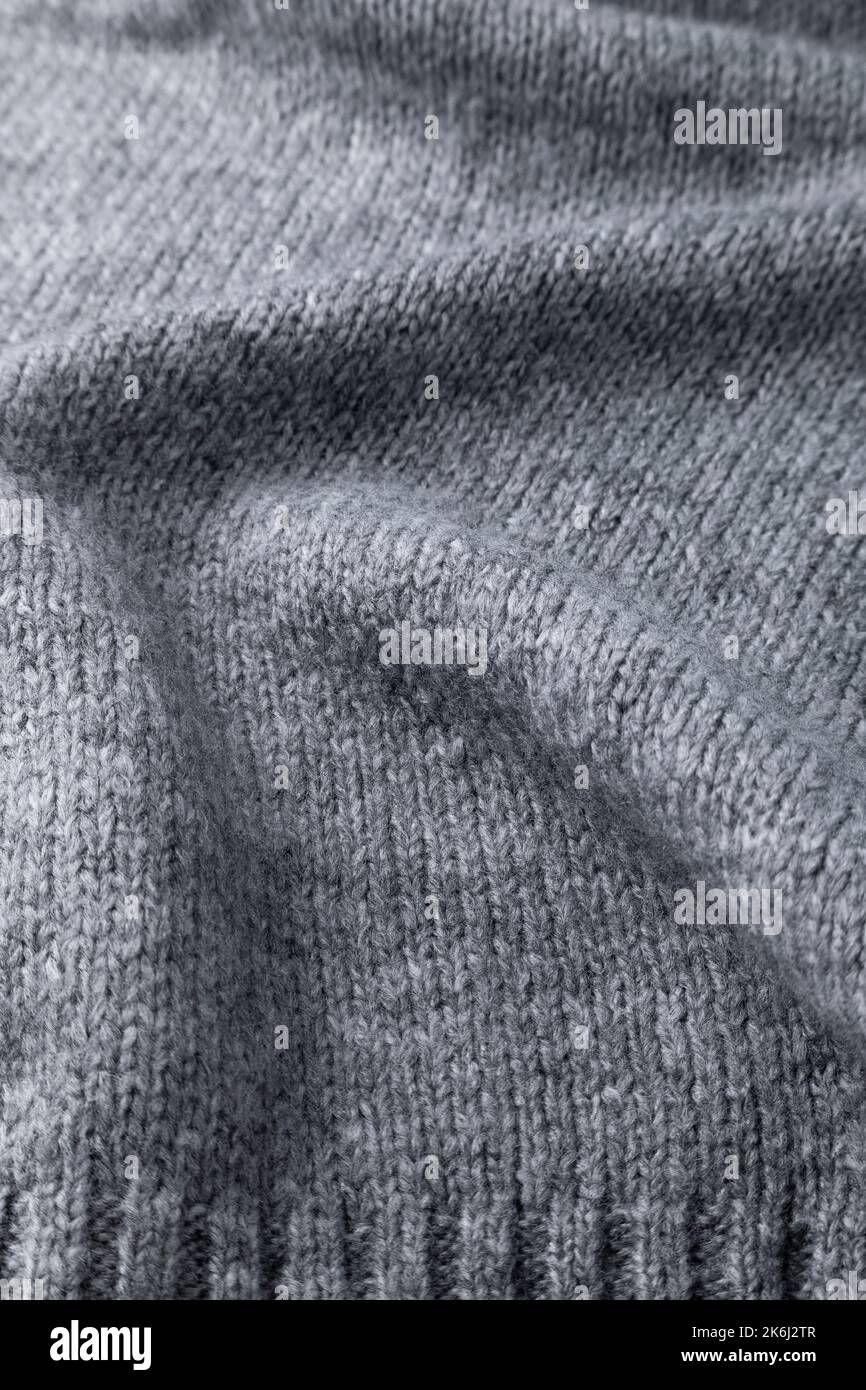 Woolen grey cloth, ondulate textile close up view Stock Photo