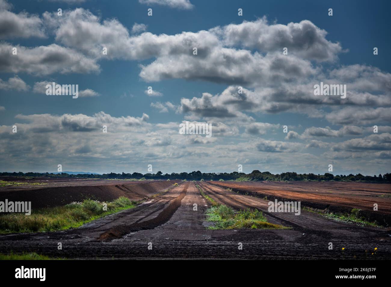 Industrial peat extraction on peatlands in the Midlands of Ireland. This is now almost a thing of the past, all turf-fired power plants are closed. Stock Photo