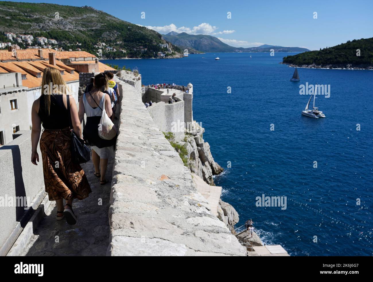 Dubrovnik city walls with tourists Stock Photo