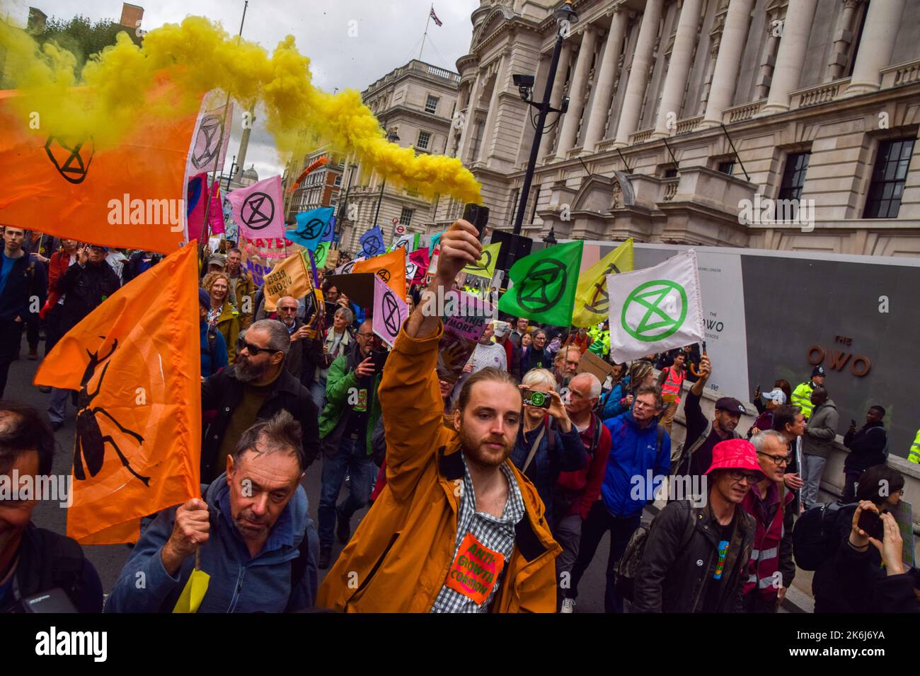London, UK. 14th October 2022. Protesters march in Whitehall. Extinction Rebellion protesters gathered in Westminster demanding action on the climate crisis and skyrocketing energy bills. Credit: Vuk Valcic/Alamy Live News Stock Photo