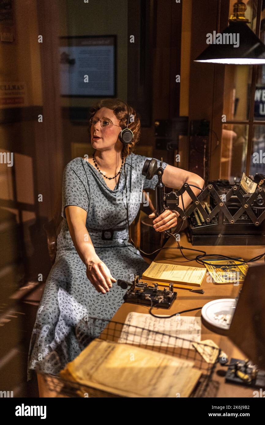 replica of a woman station agent during World War 2 working as a clerk and telegraher in California Stock Photo