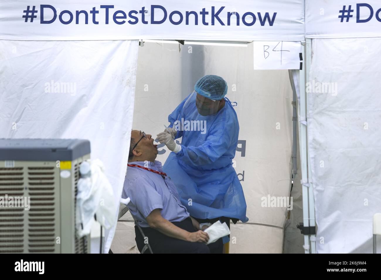 A man has his PCR test for Covid-19 at the Community Testing Station ...