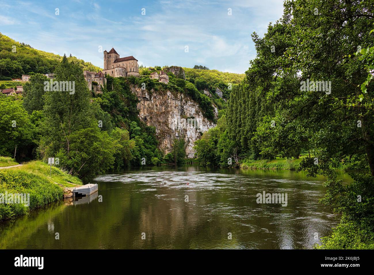 The Lot river and the Saint Cyr Lapopie village at the top of the cliff, France Stock Photo