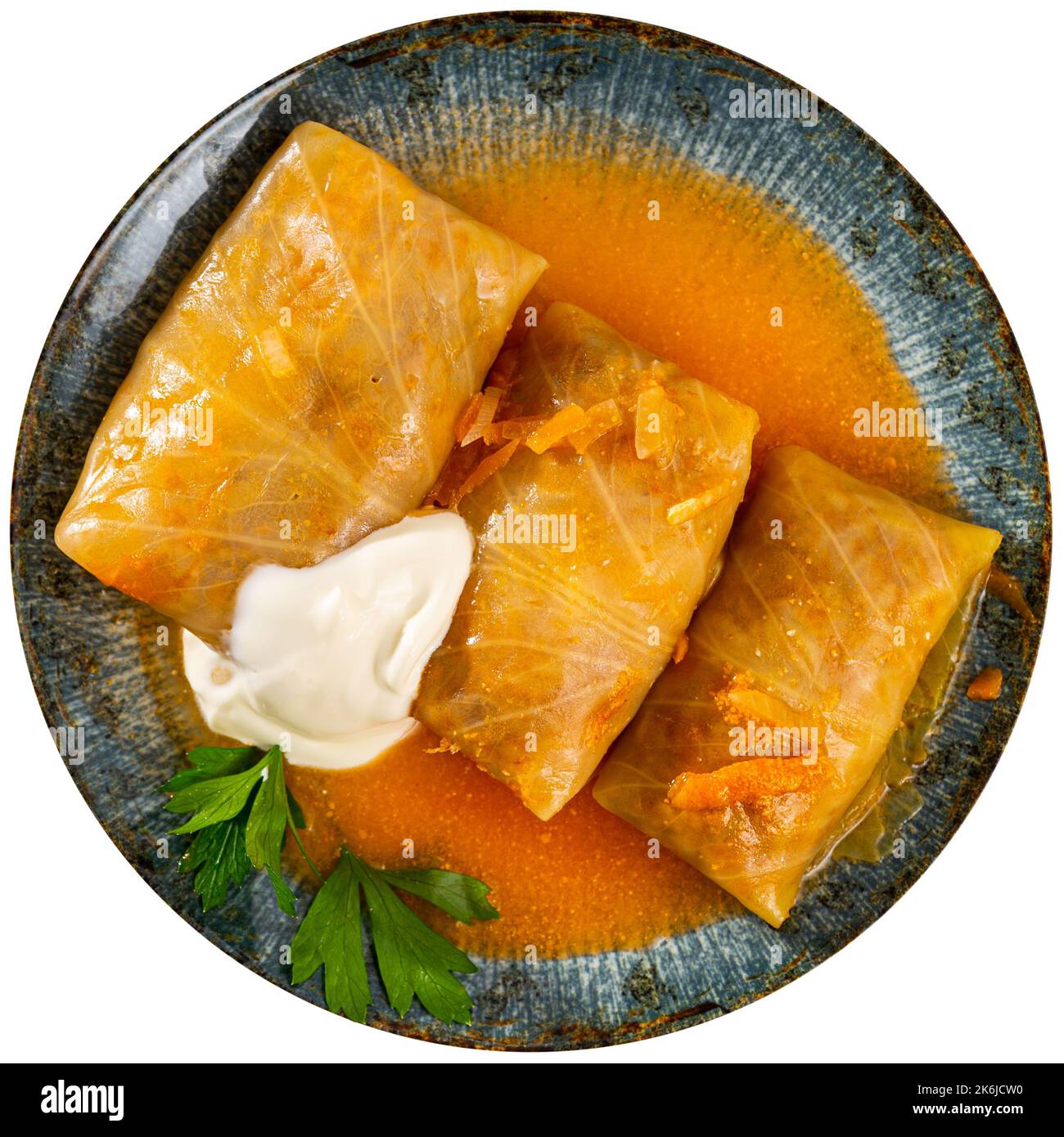 Stuffed cabbage rolls served with cream sauce Stock Photo Alamy