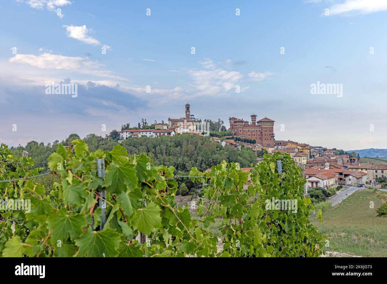 Panoramic view to Castello Cereseto in Piedmont from vineyard in the evening in summer Stock Photo