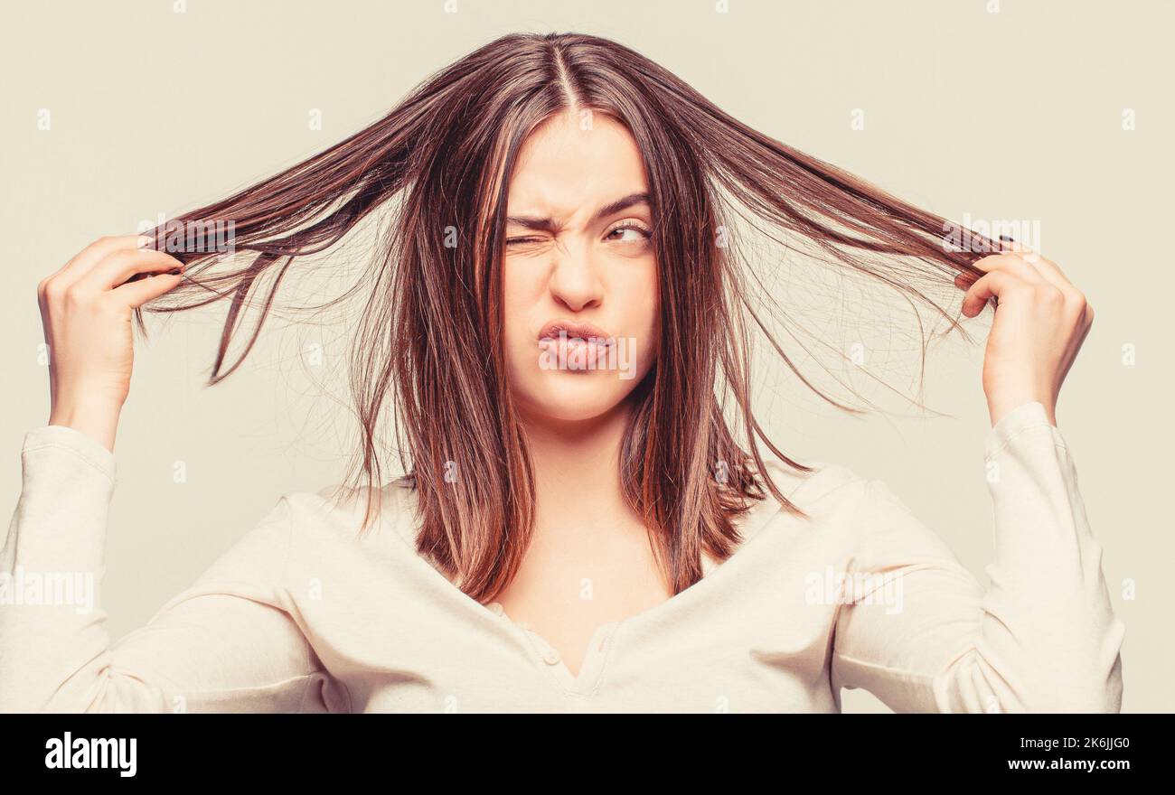 Bad hairs day. Frustrated woman having a bad hair. Woman having a bad