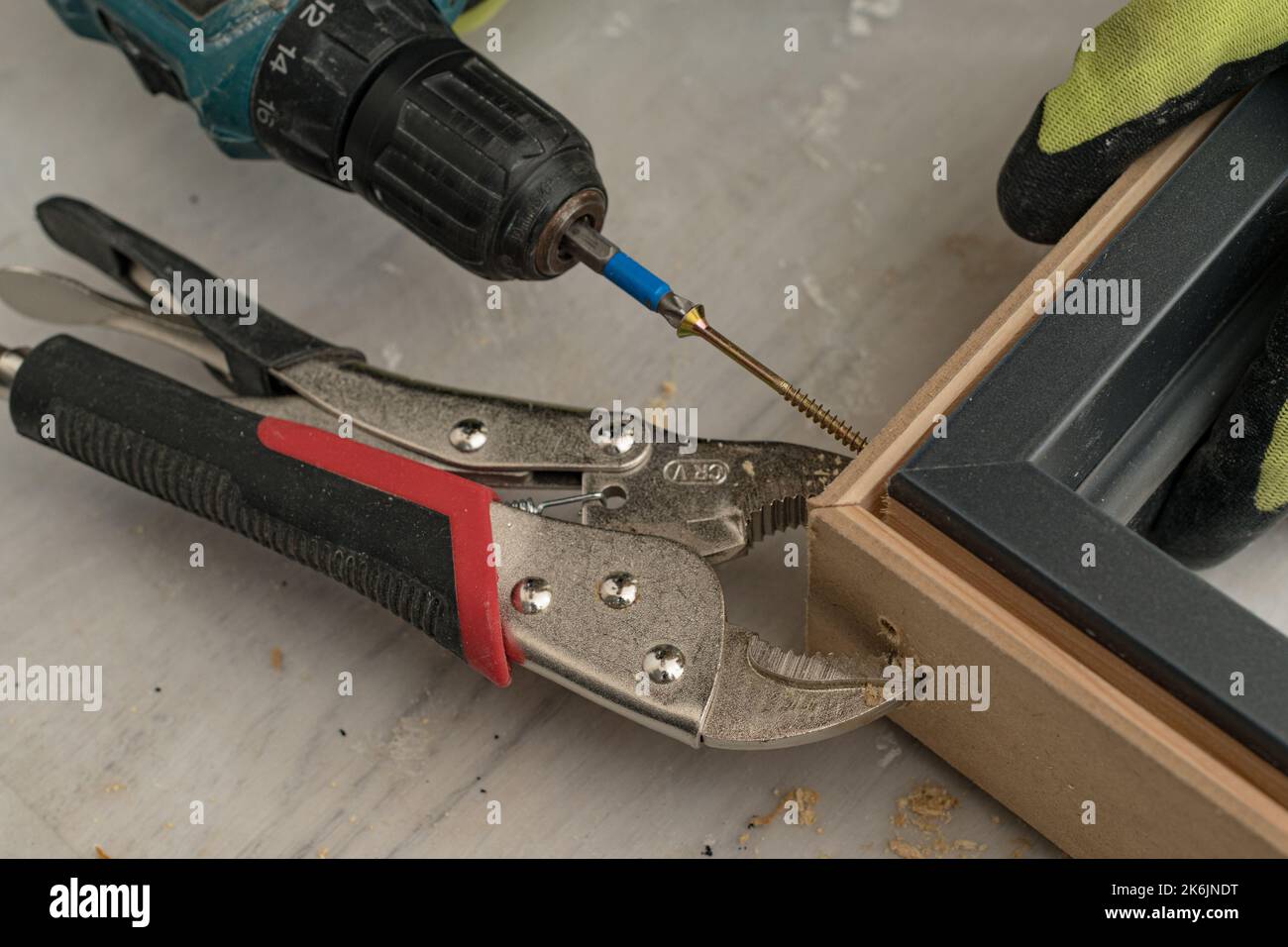 Drilling a hole in the door frame for a corner connection, installation of interior doors Stock