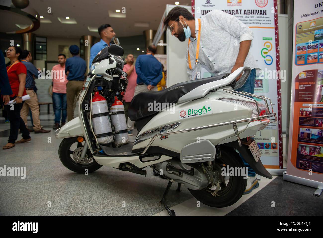 Delhi, India. 14th Oct, 2022. Student of Indian Institute of Technology Delhi showcasing Biogas fuelled scooter during inaugural day of IInvenTiv 2022, the first ever all IITs (indian institute of technology) research and development Showcase at the Indian Institute of Technology. IInvenTiv 2022 is an R&D (research and development) Fair organised under the supervision of a Steering Committee headed by Dr. Pawan Goenka, Chairman, BoG (Board of Governors) IIT and the event marks the coming together of all the 23 IITs under one umbrella to showcase their respective research and innovation experti Stock Photo