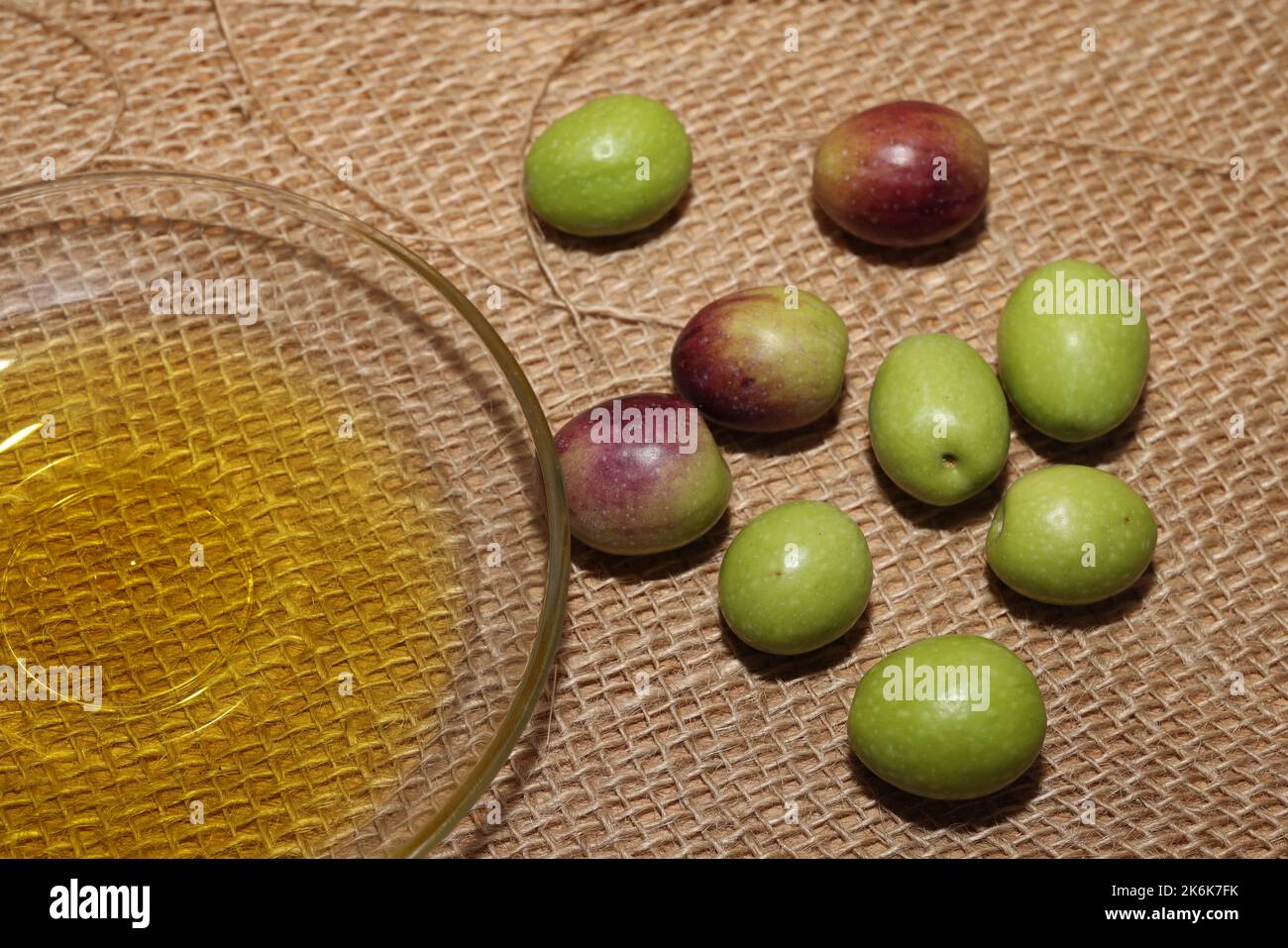 Olives and Olive Oil on wooden background Stock Photo - Alamy