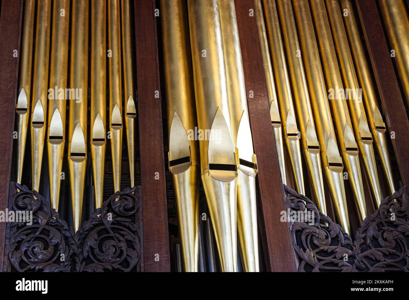 Pipes of the pipe organ inside the chapel Stock Photo