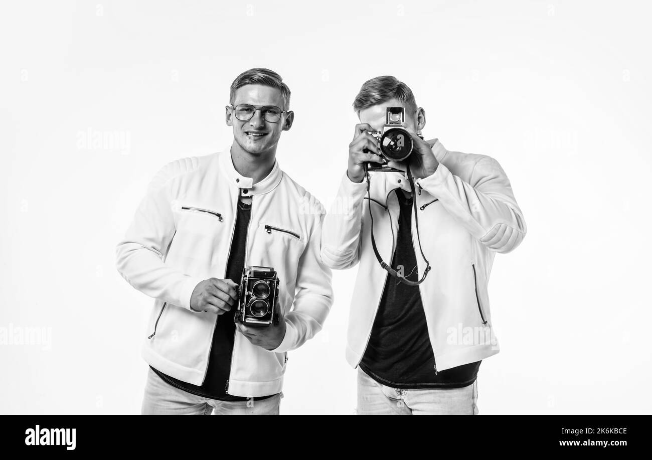 twin brothers men photographer in white casual look alike use vintage