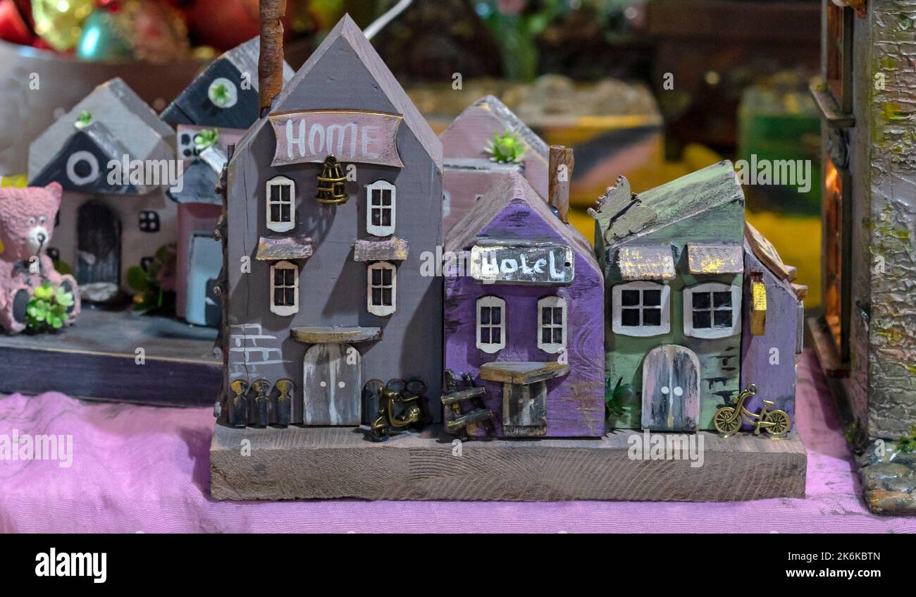 Colorful miniature wooden houses. Layout of a fabulous city. Stock Photo