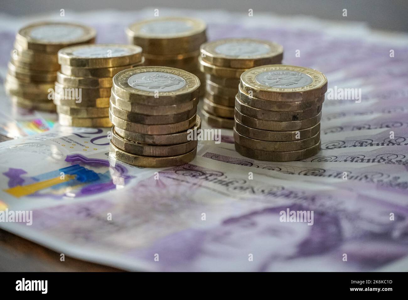 British twenty pound notes and one pound coins Stock Photo