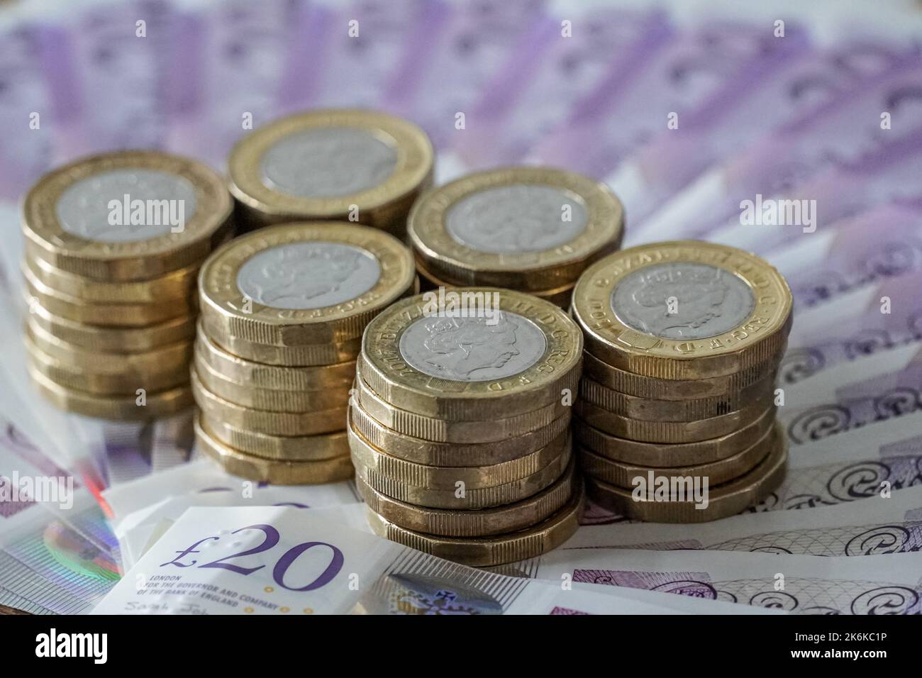 British twenty pound notes and one pound coins Stock Photo