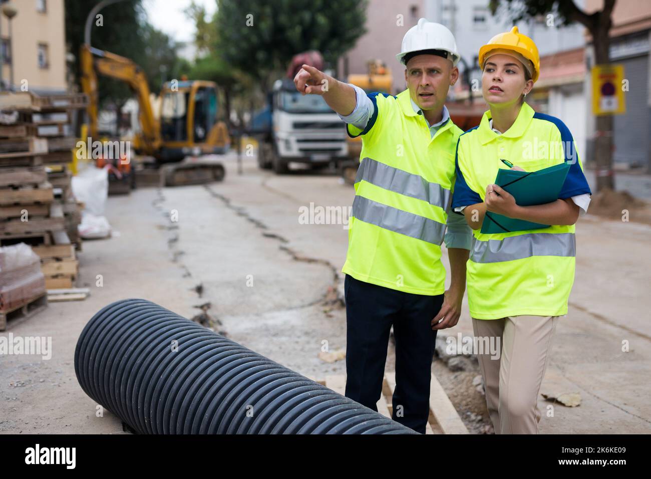 Two qualified engineers are discussing a construction plan Stock Photo