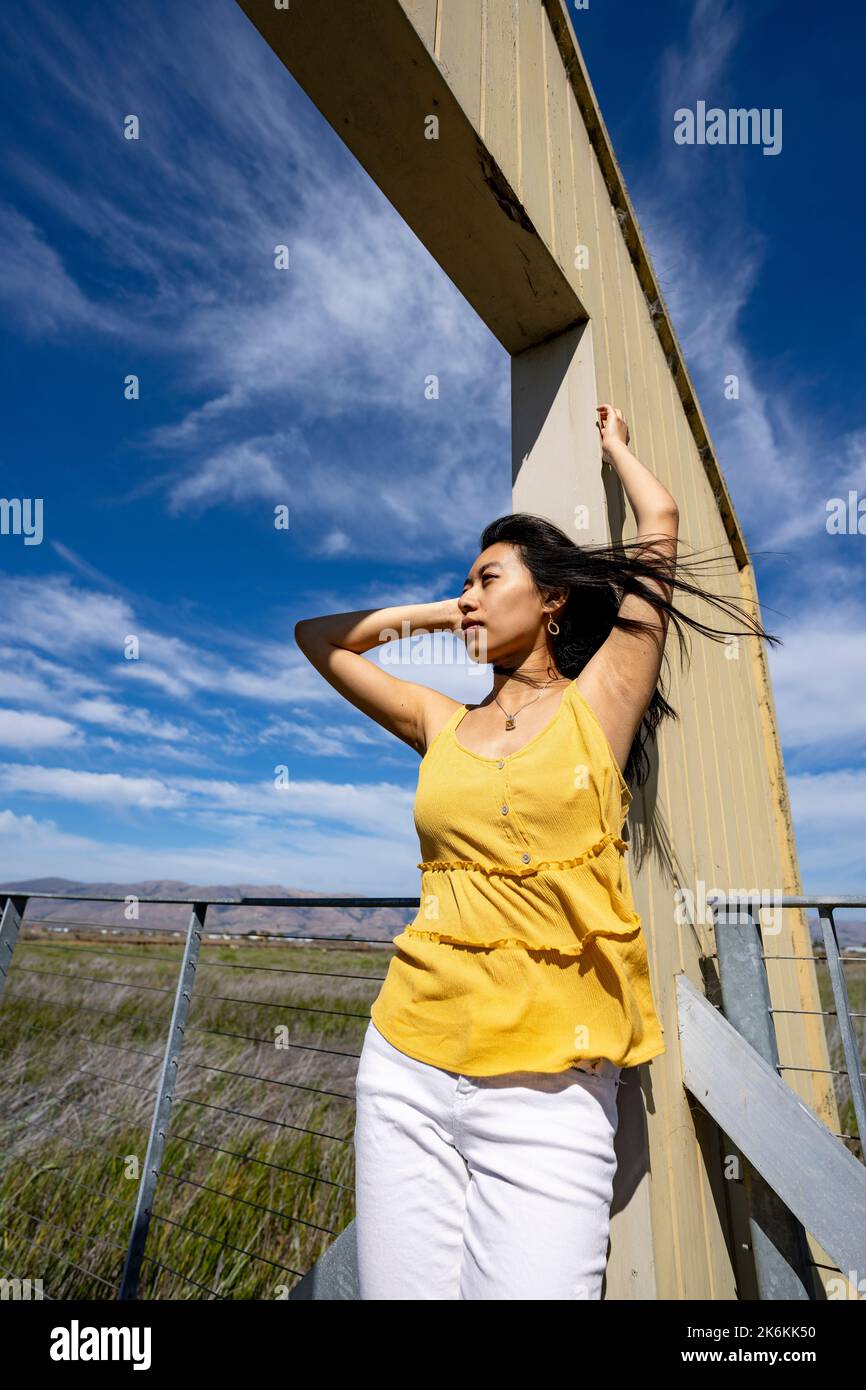 Lifestyle | Portrait of a Young Woman in a Doorway to Nature Stock Photo