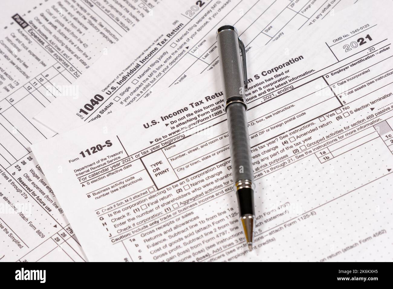 Shot of various IRS tax forms, 1040, 1120-S for sending in personal and corporate tax returns. Stock Photo