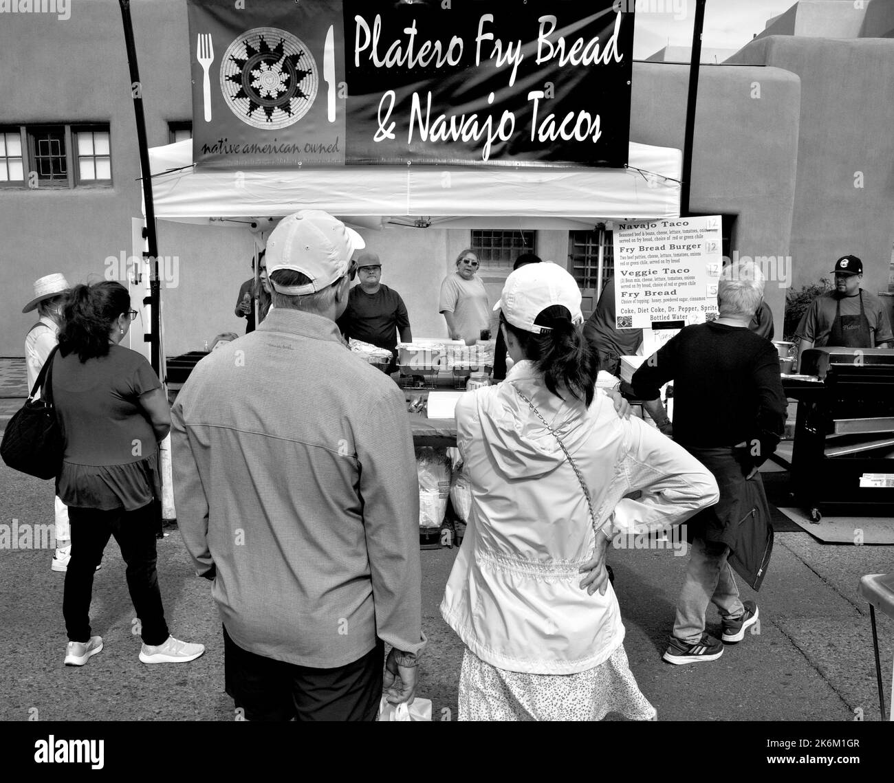 Customers buy lunch at a Native American-owned food vendor at an outdoor festival in Santa Fe, New Mexico. Stock Photo