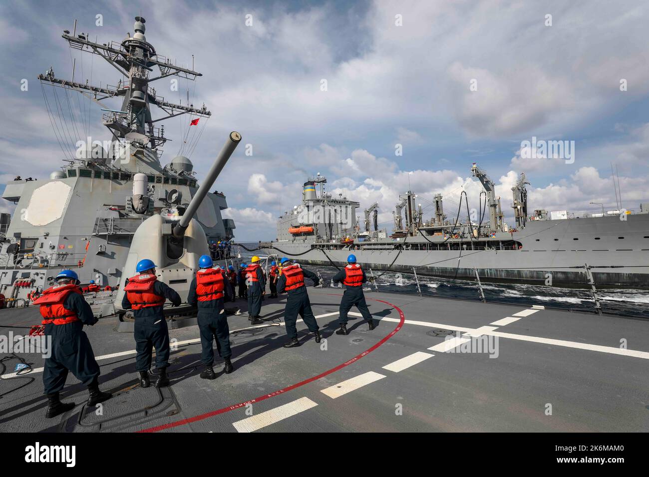 SOUTH CHINA SEA (Sept. 24, 2022) Sailors handle a phone-and-distance ...