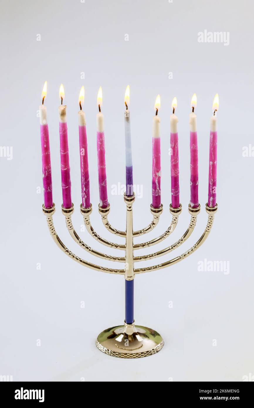 Jewish holiday candles lit in Menorah for Hanukkah festival symbols