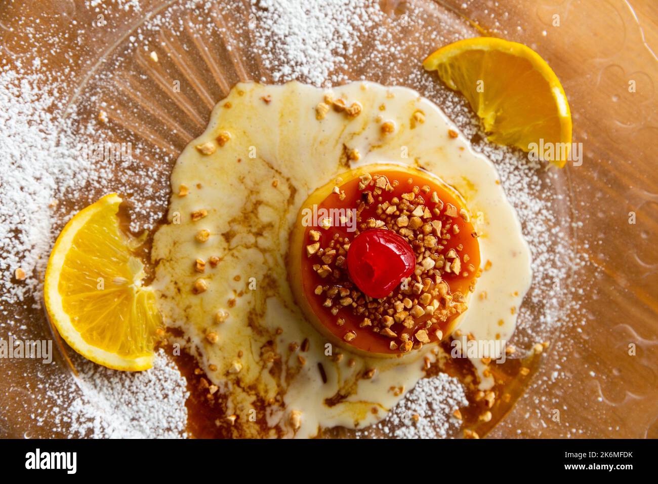 Caramel tocino de cielo with crushed nuts and fruits Stock Photo Alamy