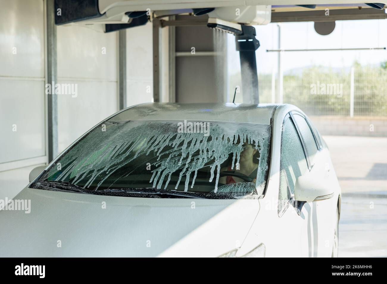 Process of car washing with driver inside Stock Photo Alamy
