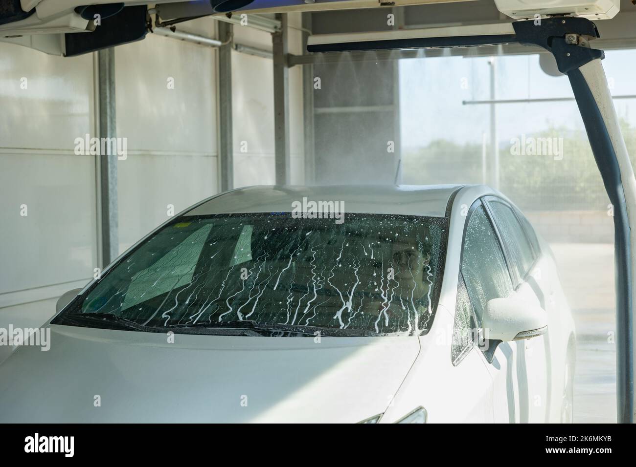 Car wash machine spraying water and detergent Stock Photo Alamy