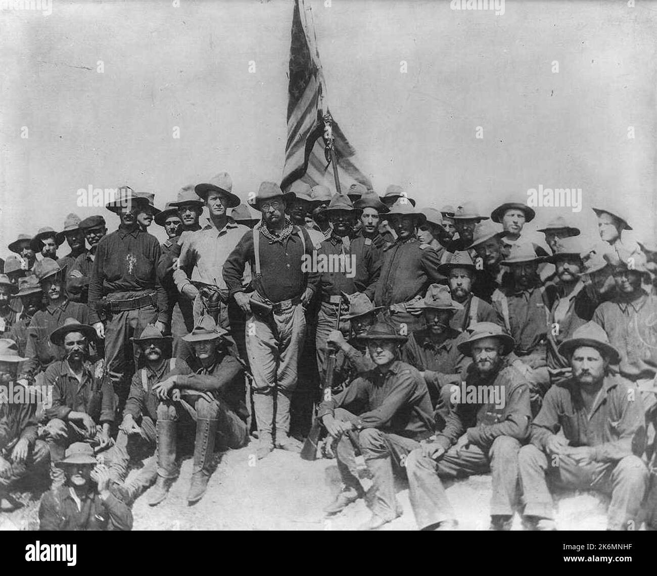 Colonel Theodore Roosevelt and the Rough Riders after capturing Kettle Hill in Cuba in July 1898, along with members of the 3rd Volunteers and the regular Army black 10th Cavalry Stock Photo