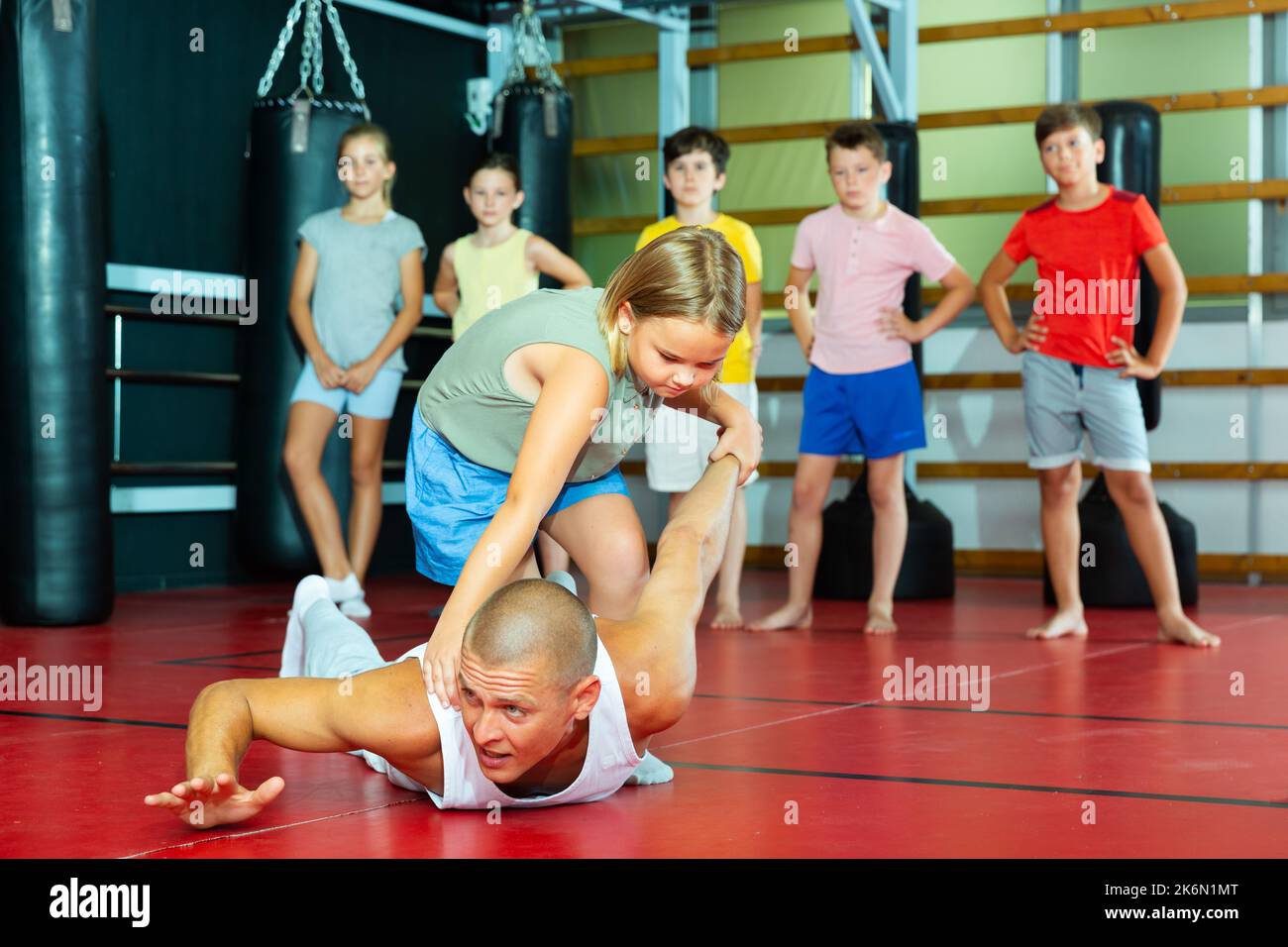 Young schoolgirl practicing basic self-defense moves Stock Photo - Alamy