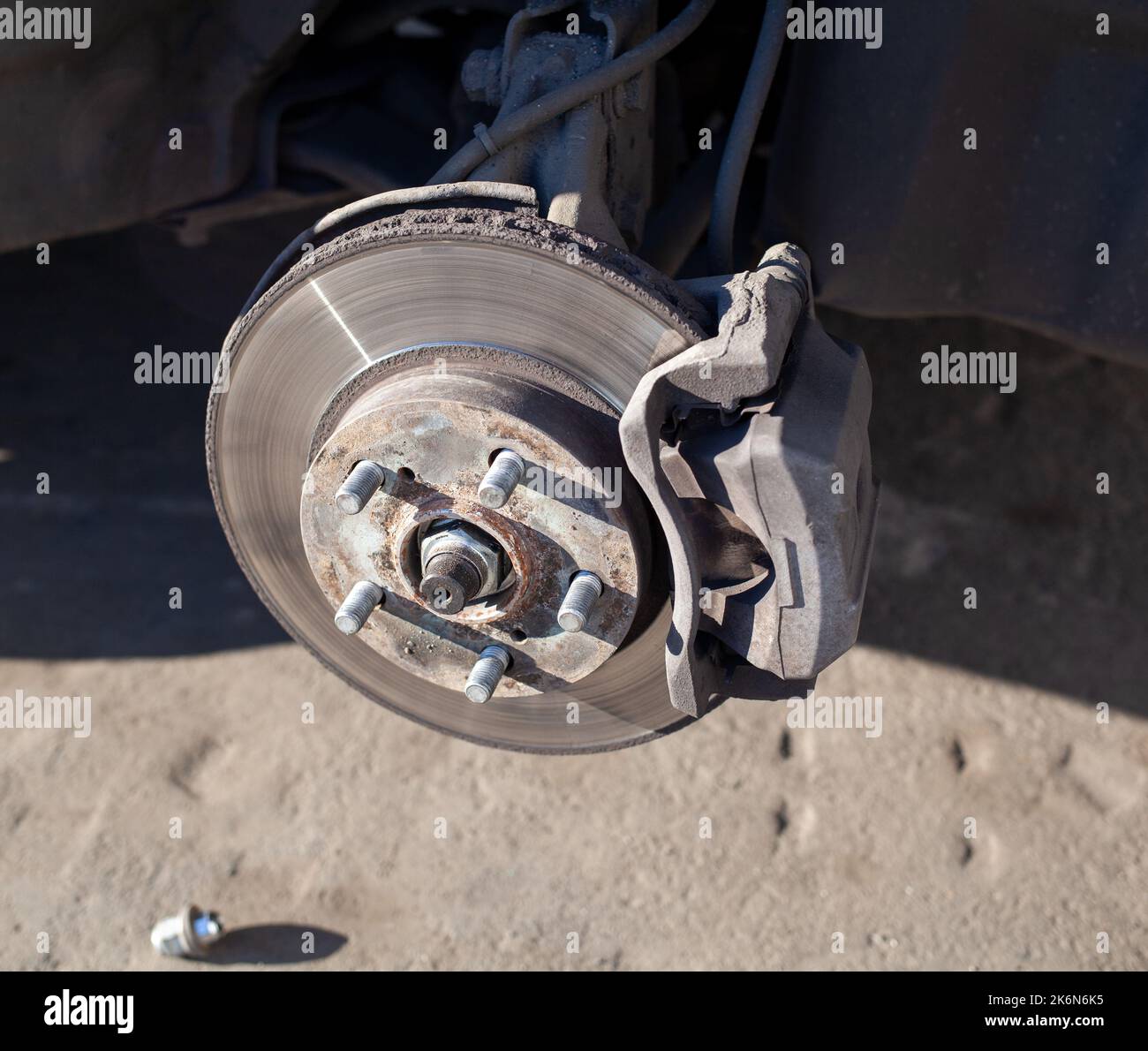Disc brake of the vehicle for repair - Disc Brake Of The Vehicle For Repair In Process Of New Tire Replacement Car Brake Repairing In Garagesuspension Of Car For Maintenance Brakes And S 2K6N6K5 