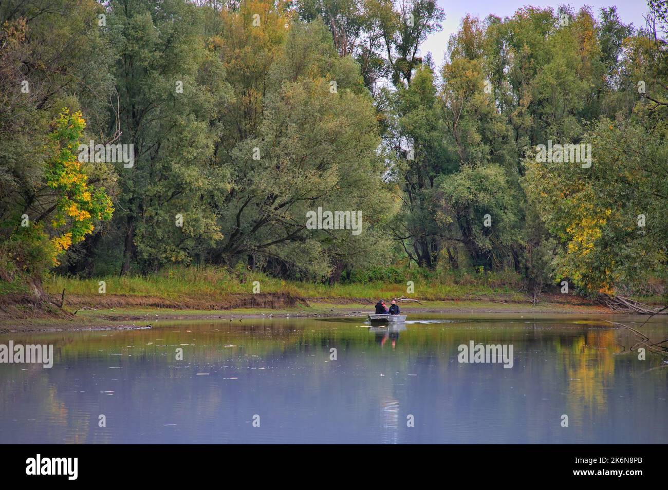 Scenic view of the calm river with boat on it Stock Photo