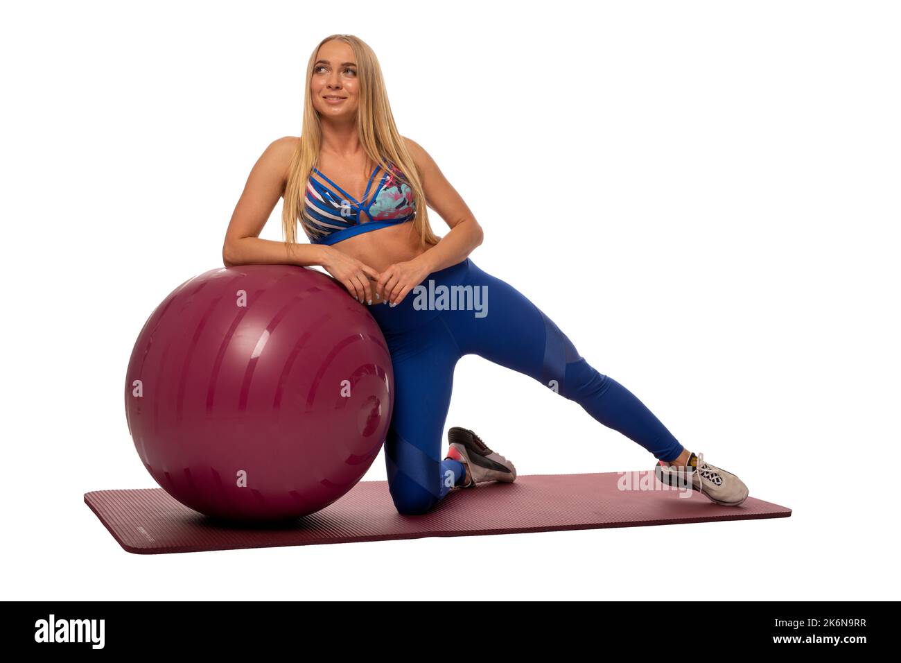 Fit woman doing exercises on fitness ball Stock Photo
