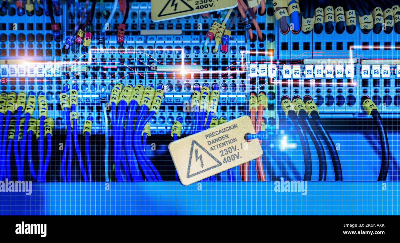 Electric wiring diagram of machinery in industrial factory. Terminal diagram with tag and warning label. High voltage electric wire. Automation Stock Photo