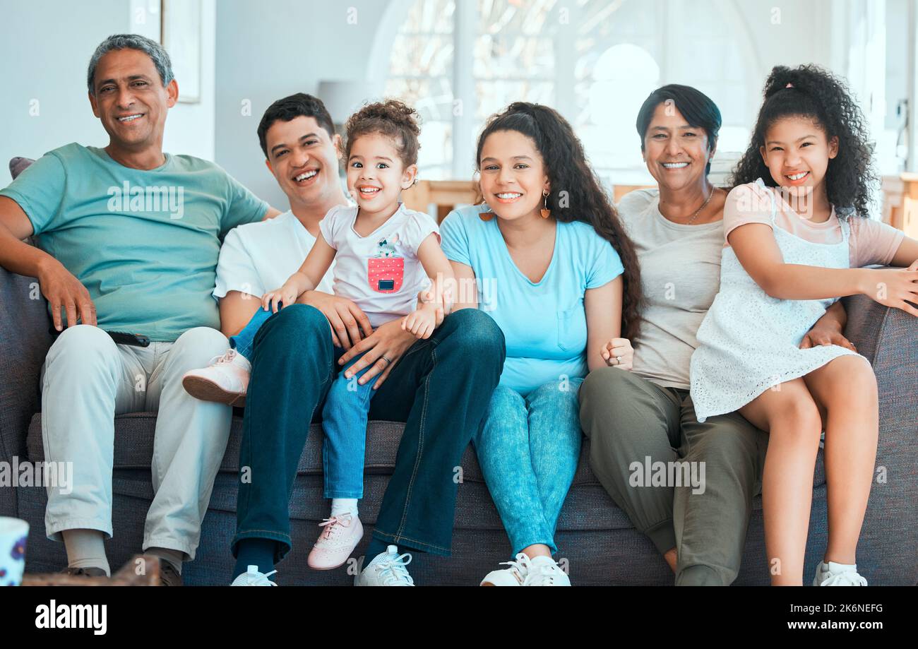 Big smiles all round. a beautiful family bonding on the sofa at home. Stock Photo