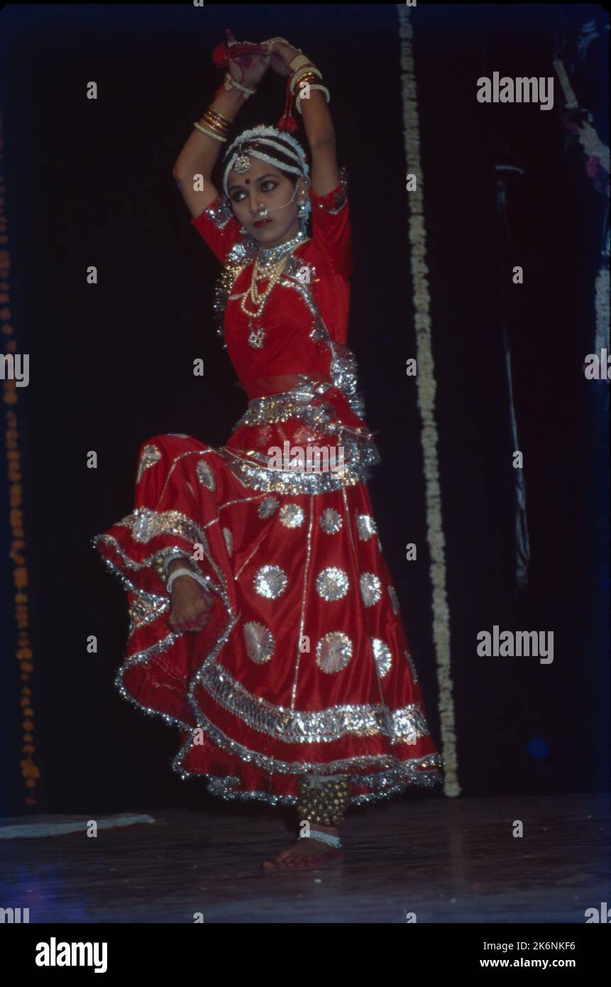 Kathak:- One of the main forms of Classical Dance Drama, It is indigenous to northern India and developed under the influence of both Hindu and Muslim Cultures. It is characterized by intricate foot work and pattern of controlling 100 ankle bells. Kathak is danced y both males and females many of dance conveys mood of Love. Stock Photo