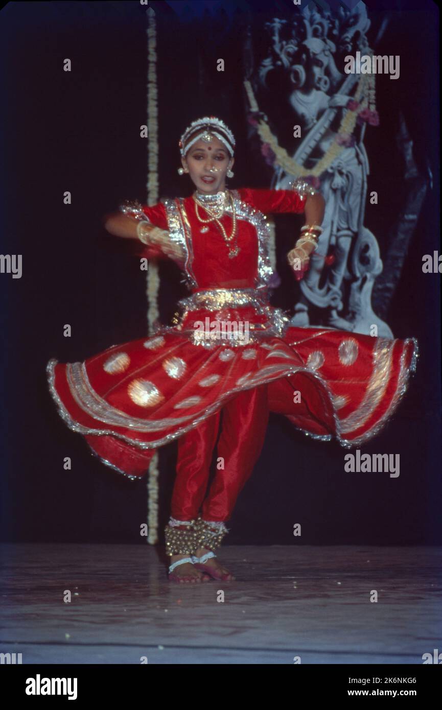 Kathak:- One of the main forms of Classical Dance Drama, It is indigenous to northern India and developed under the influence of both Hindu and Muslim Cultures. It is characterized by intricate foot work and pattern of controlling 100 ankle bells. Kathak is danced y both males and females many of dance conveys mood of Love. Stock Photo