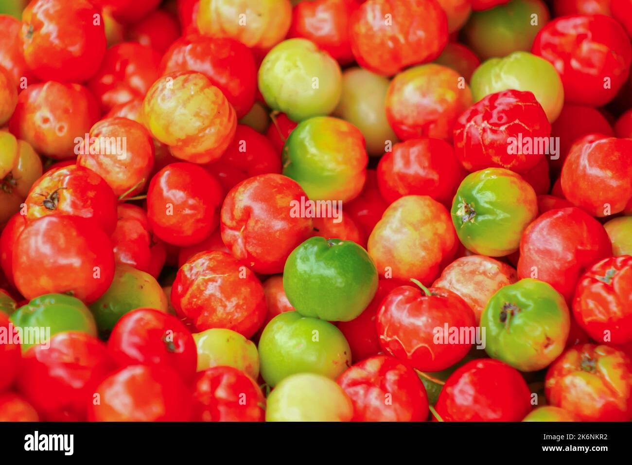 Group of red acerola also known as malpighia glabra Stock Photo