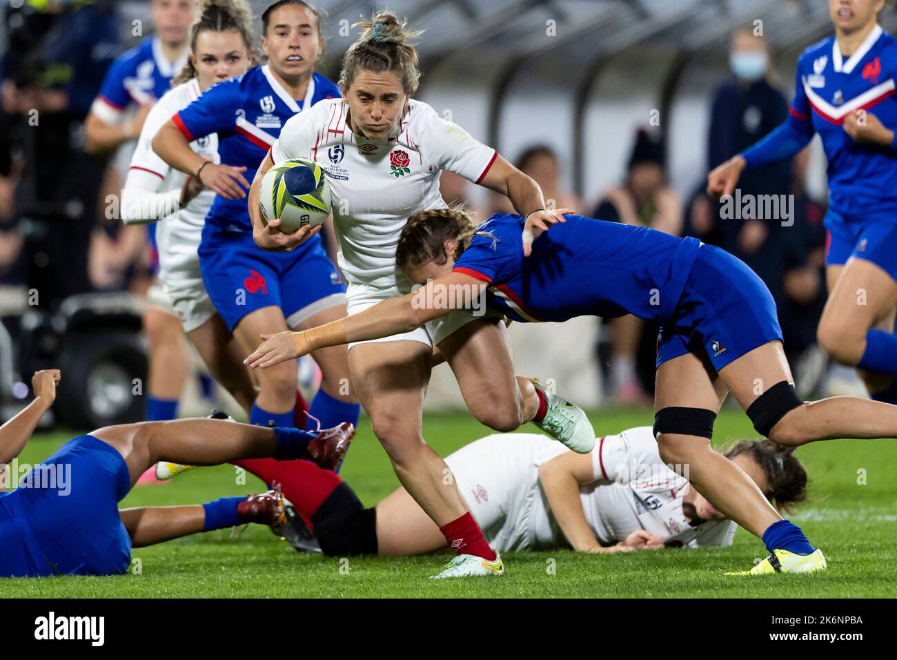 England's Claudia MacDonald is tackled during the Women's Rugby World