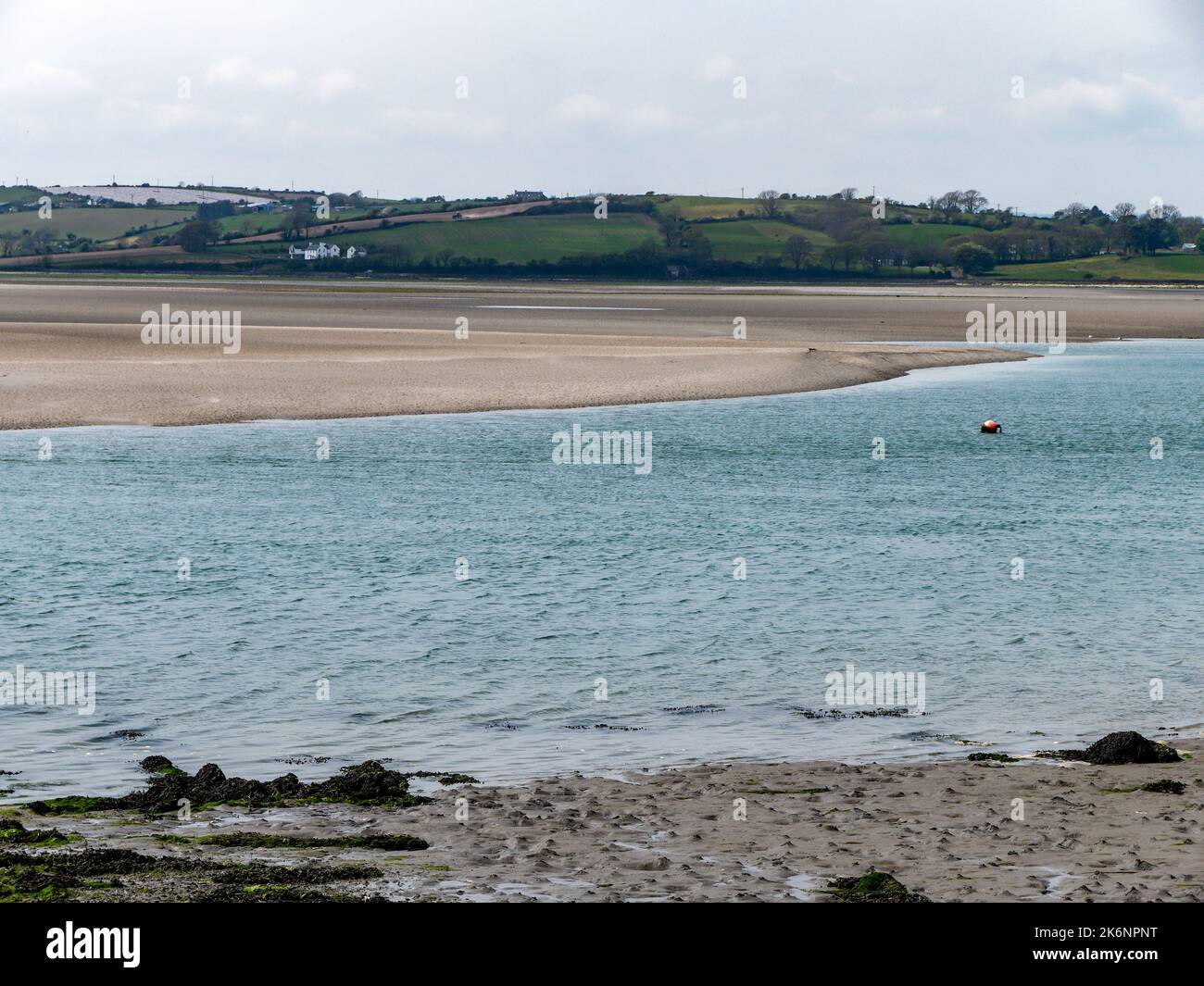 Silt on the exposed seabed at low tide. The shallow sea bay. Seaside