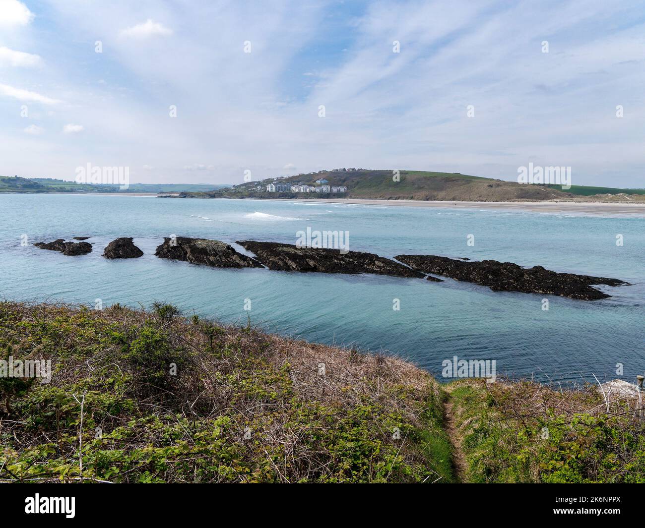 Dense coastal bushes. View of Clonakilty Bay. Sea rocks. A picturesque place in northern Europe, rock formation near body of water. The nature of Irel Stock Photo