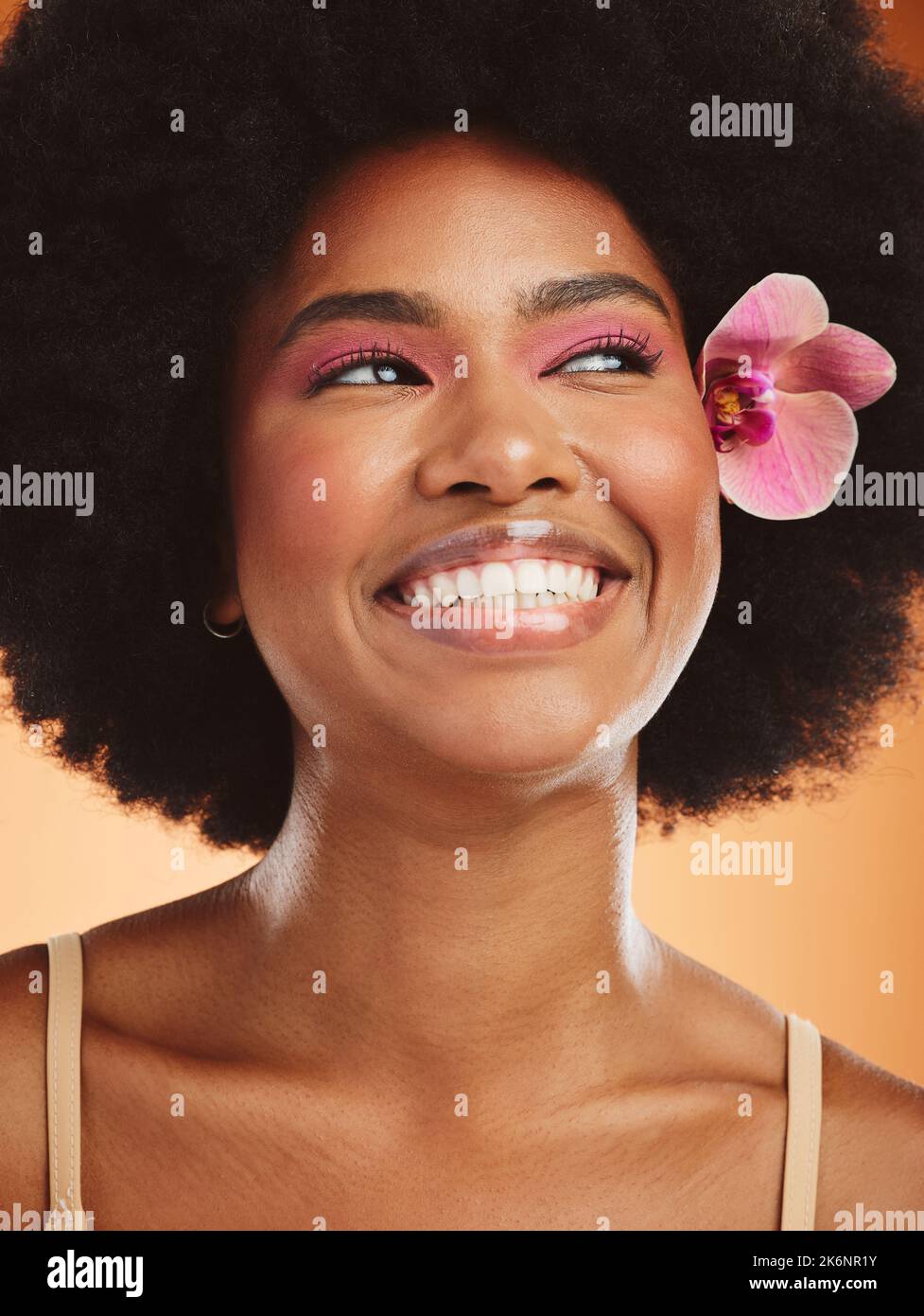 Beauty, skincare and black woman with flower in afro hair with pink
